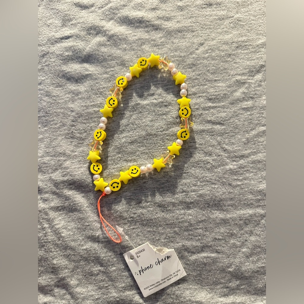 Smiley face phone charm